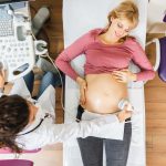 beautiful-happy-expectant-mother-doing-ultrasound-scan-prenatal-clinic